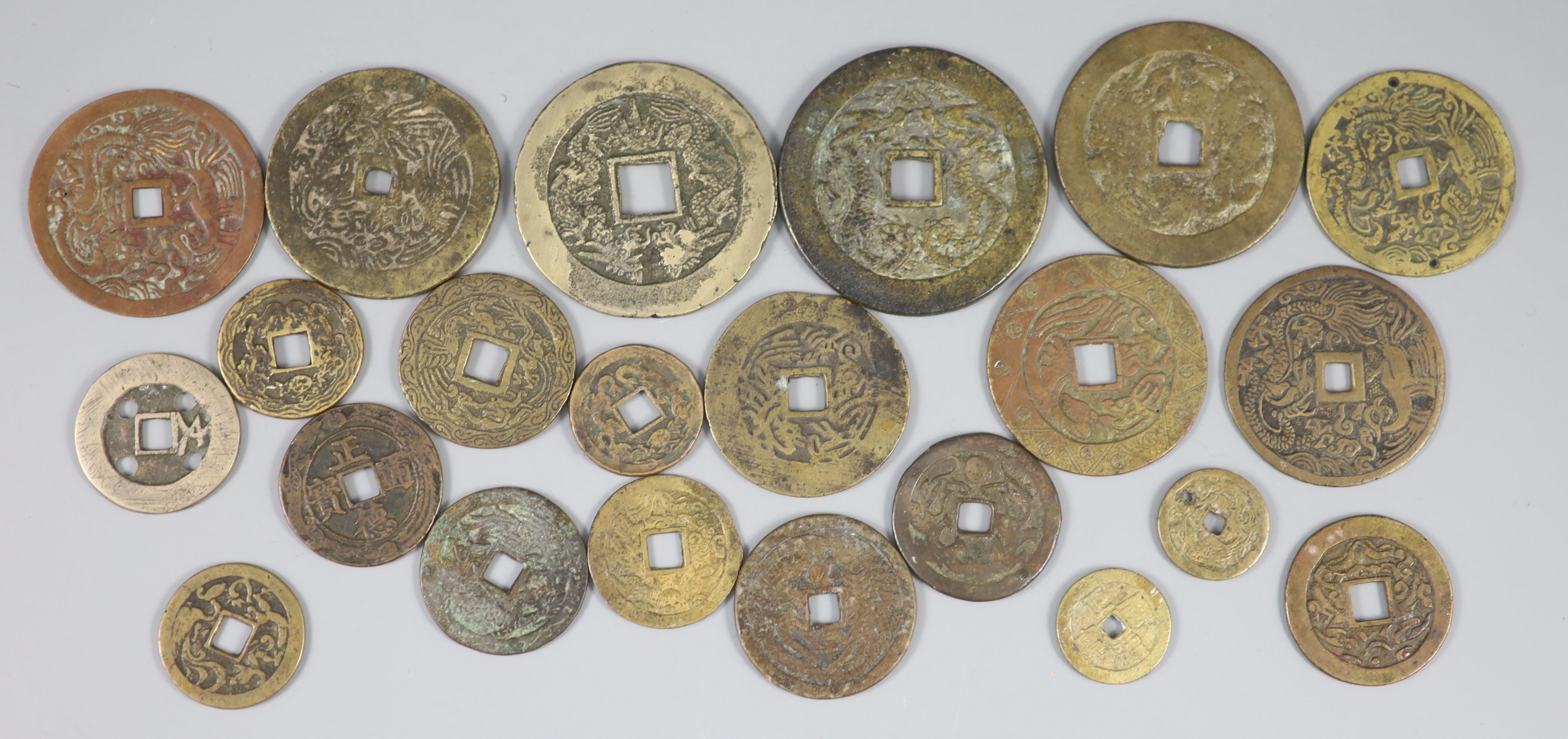 China, a group of 22 bronze or copper coin charms, Qing dynasty,